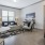 a living room with a rug and a couch