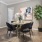 a dining room with a table and chairs