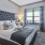 a bedroom with a bed and a desk