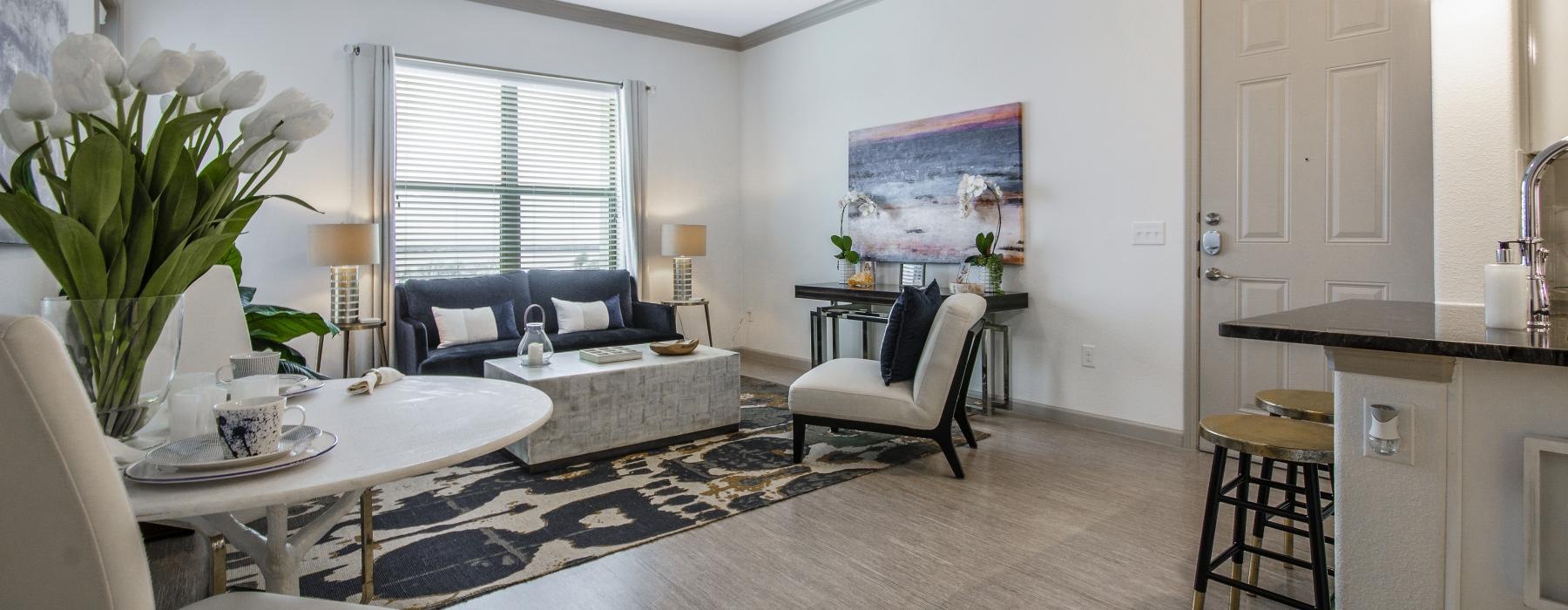 a living room with a rug and a couch