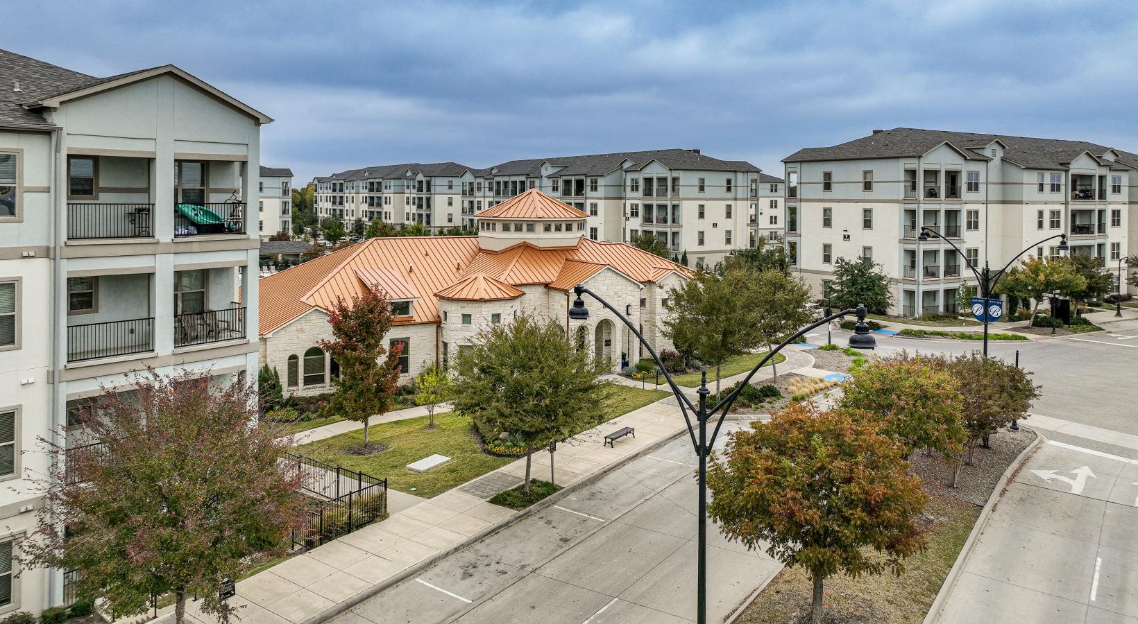 Find your perfect fit at Park at Bayside a group of buildings with trees and bushes in front of them