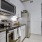 a kitchen with white cabinets
