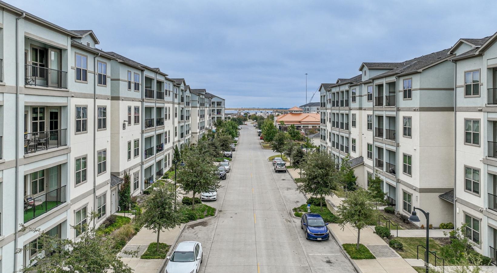 The essence of exceptional living a street with cars and buildings