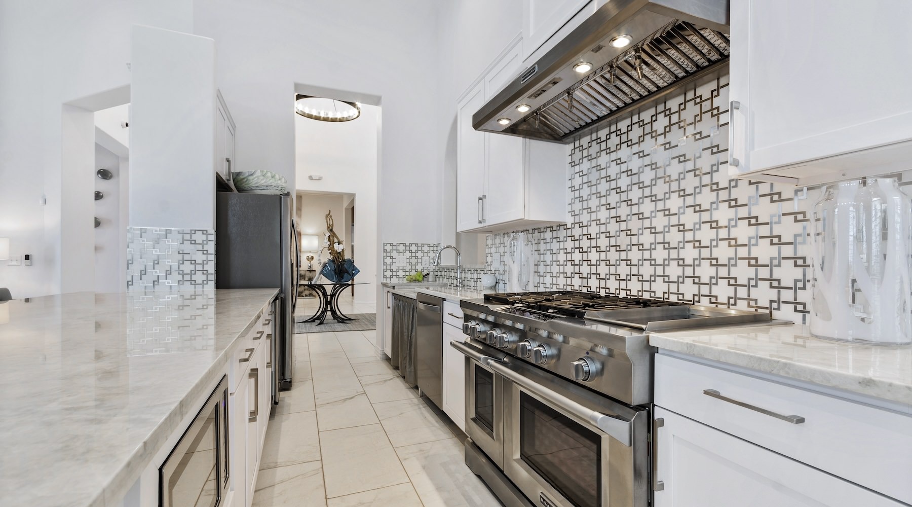 Take advantage of all Park at Bayside has to offer large clubhouse kitchen with white cabinets and stainless steel appliances