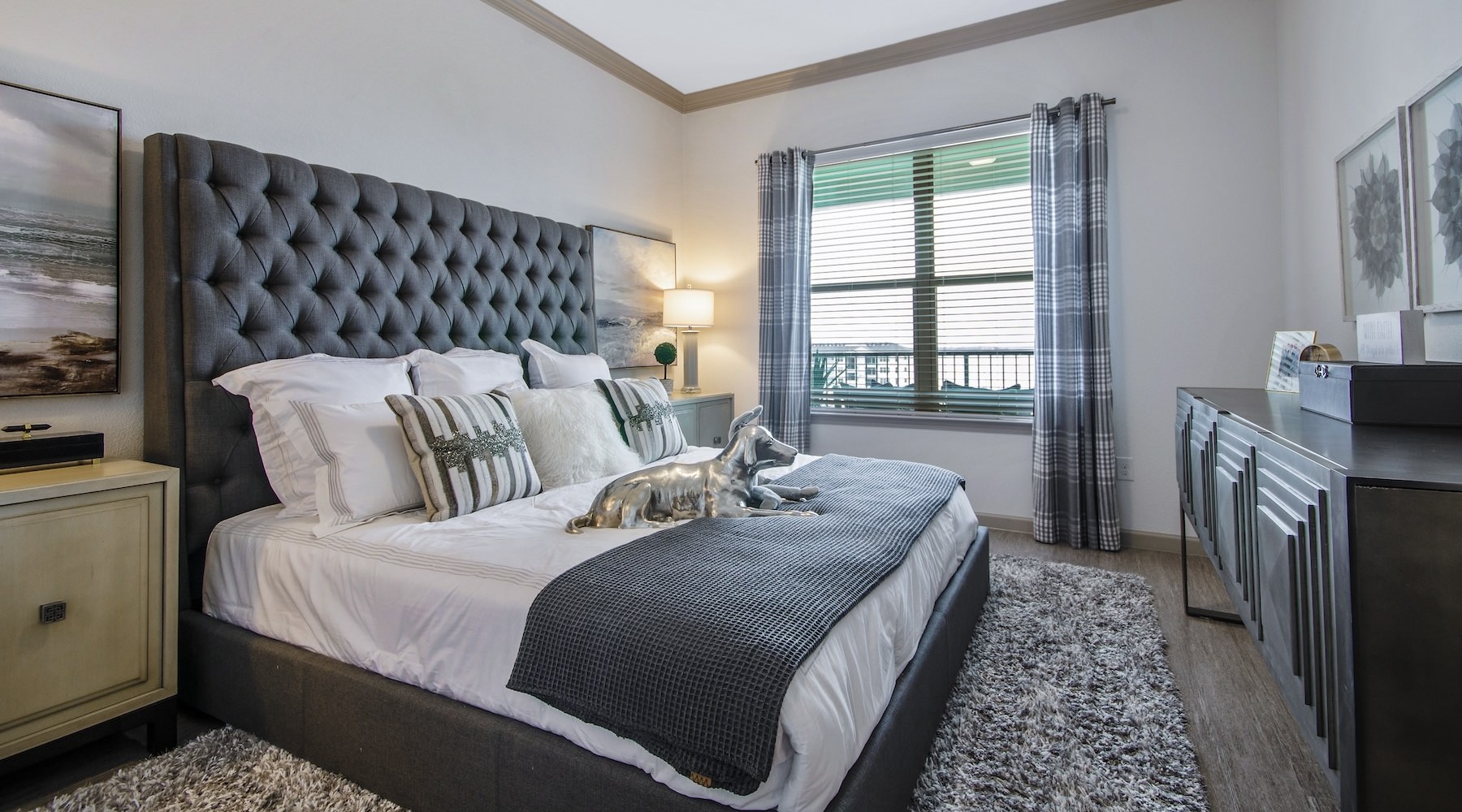 Sleep in style bedroom with a large bed and large window