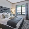 bedroom with a large bed and large window