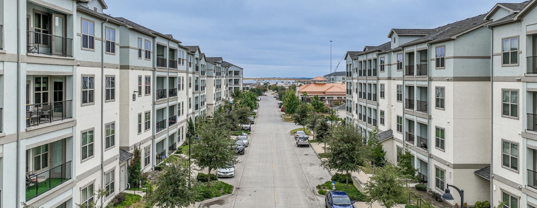 a street with cars and buildings