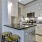 a kitchen with white cabinets