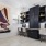 a room with a desk and chairs