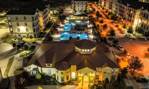 a large building with a parking lot