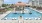 a pool with chairs around it