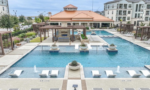 a pool with chairs around it