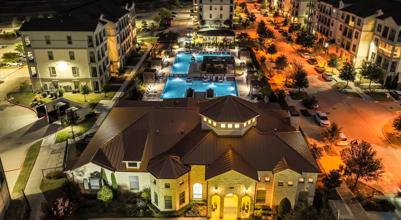 The essence of exceptional living a large building with a parking lot