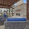 a patio with a couch and chairs