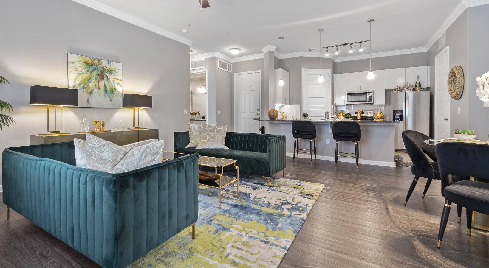 Gorgeous living areas to entertain and enjoy a living room with a blue couch and a fan