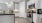 a kitchen with white cabinets