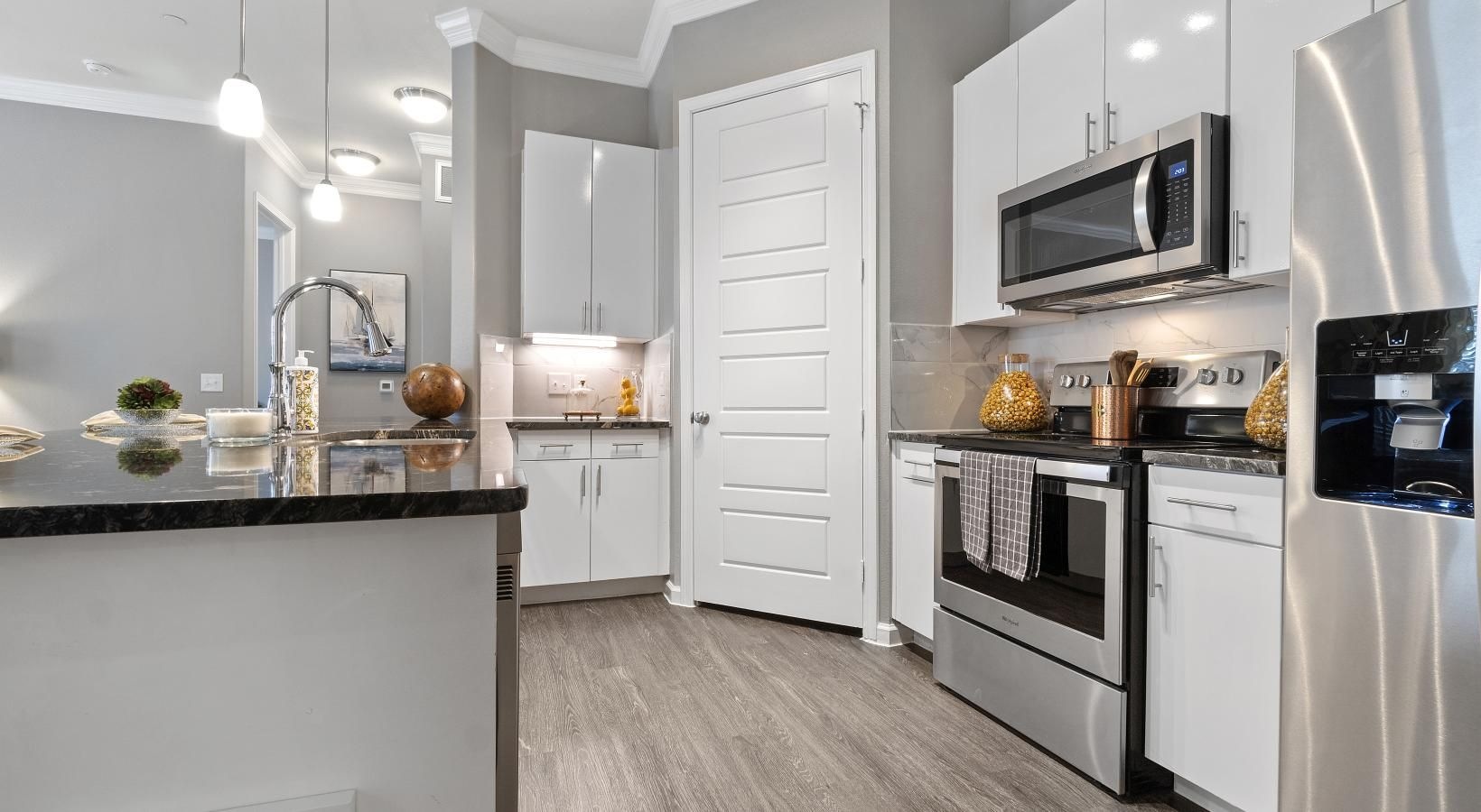 Spacious kitchens with thoughtful details a kitchen with white cabinets