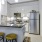 a kitchen with stools and a bar stool
