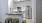 a kitchen with stools and a bar stool