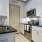 a kitchen with white cabinets
