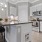a kitchen with white cabinets