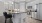 a kitchen with white cabinets