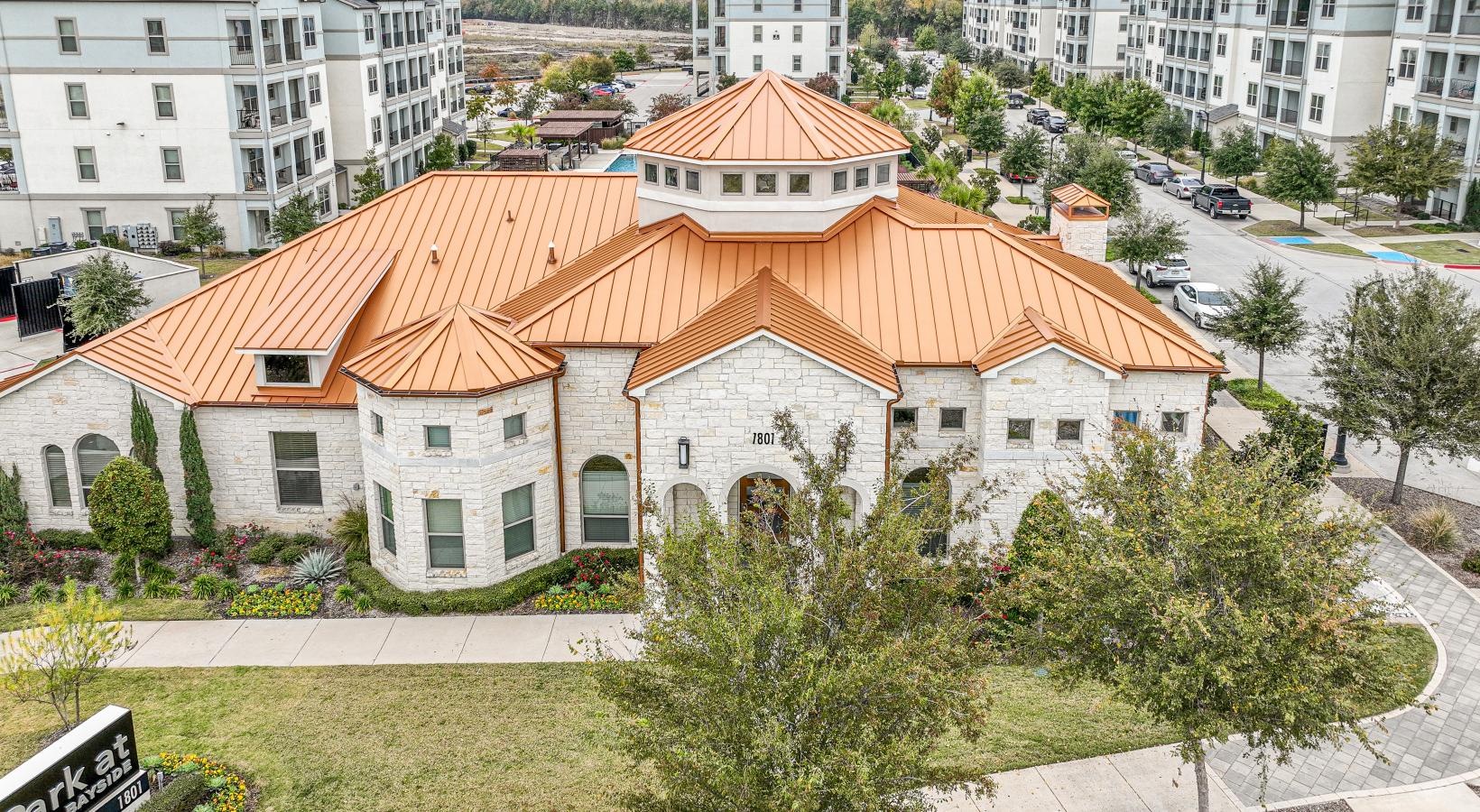 Settle into comfort at Park at Bayside a building with a red roof