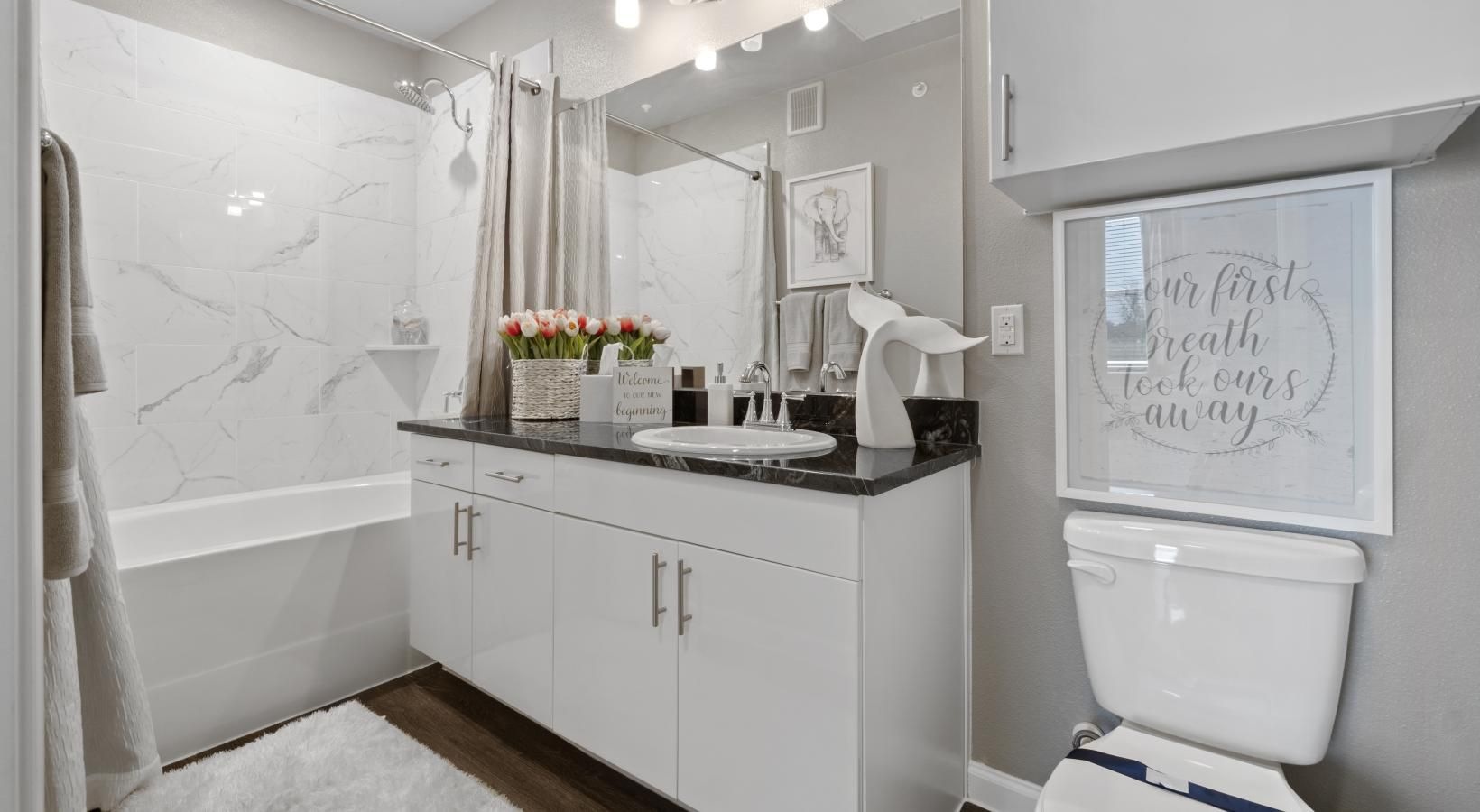 Bathroom options with thoughtful details a bathroom with a sink toilet and a shower